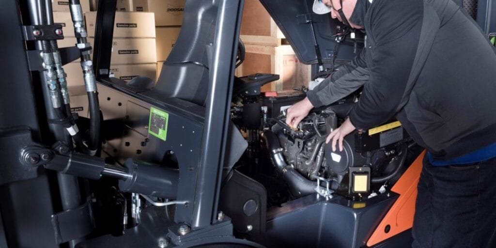 forklift maintenance inspection in warehouse